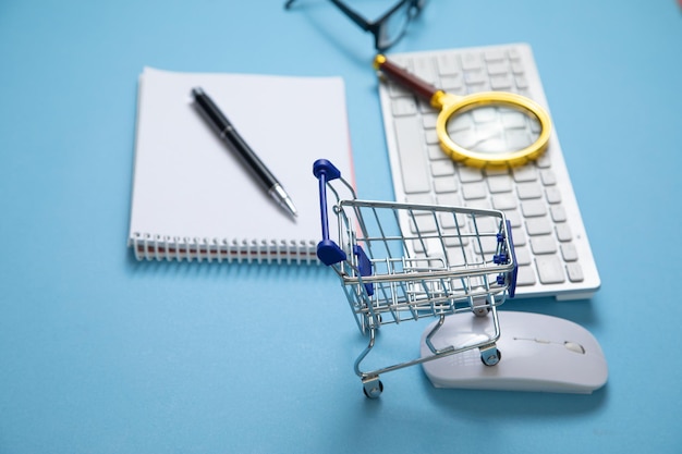 Shopping cart with a computer keyboard and business objects