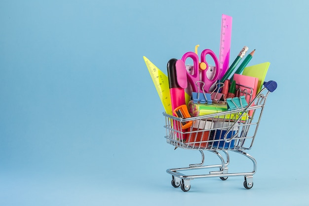 Shopping cart with different school supplies