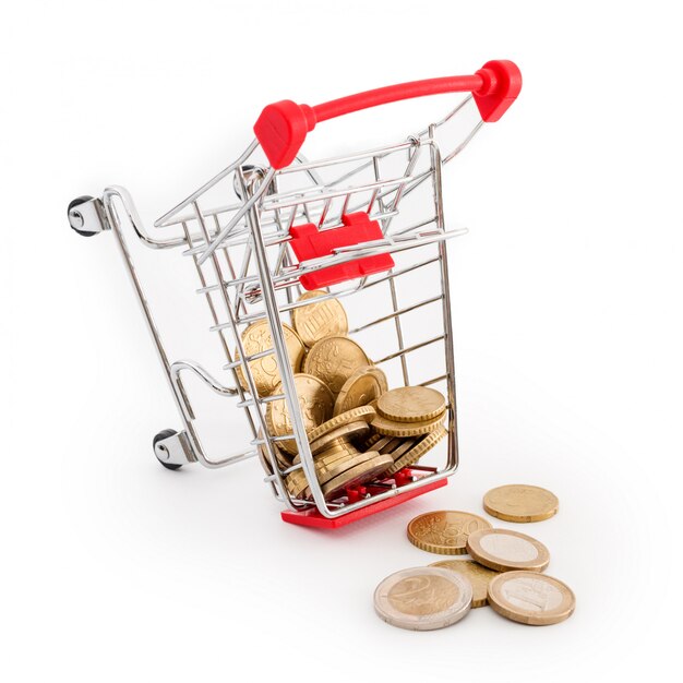 Shopping cart with euro coins in it is falling on white background. Conceptual representation of a failure, poverty and being broke. Supermarket shopping, sale and cash back theme. Copyspace for text.