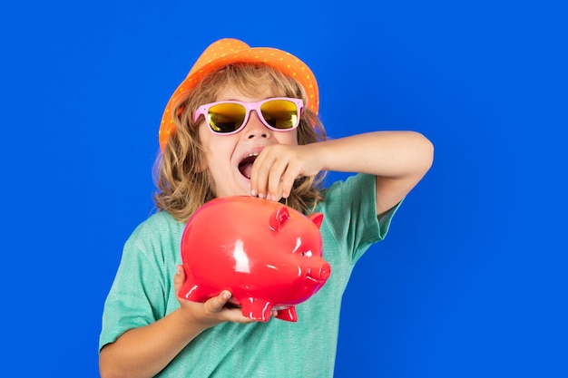 Shopping Child boy putting in piggy bank usd coin