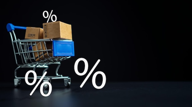 Photo shopping concept paper boxes in blue shopping cart with sale price tag on dark background