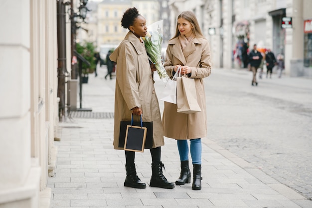 Shopping day. International girlfriends. Women in a city.