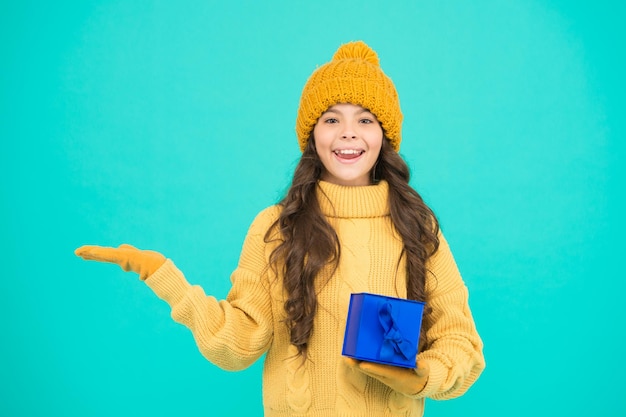 Shopping day small cute girl received holiday gift enjoy receiving presents christmas gifts for kids kid little cheerful girl hat long hair hold gift box child excited about unpacking her gift