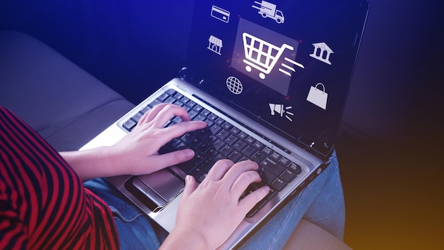 shopping online woman using online shopping on laptop computer with virtual graphic icon diagram payment online digital marketing business finance internet network technology concept