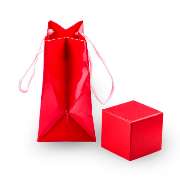 Shopping red paper template and shiny red gift box on white background