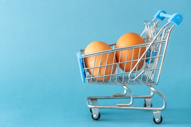 Shopping toy trolley with eggs  concept