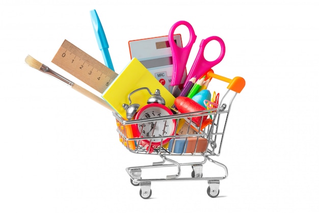 Shopping trolley filled with multicolored school supplies isolated on white