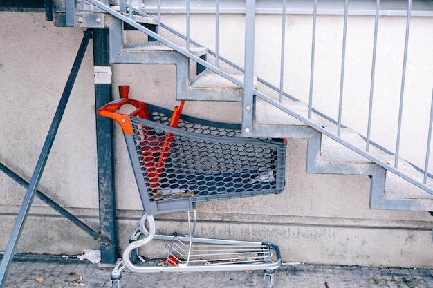 Shopping trolley under the stairs