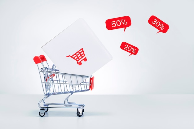 Shopping trolley with delivery box and sale of special offers. Black Friday Sale Concept.