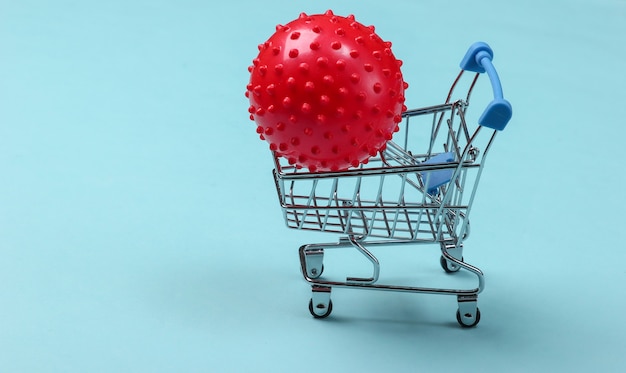 Shopping trolley with massage ball on a blue