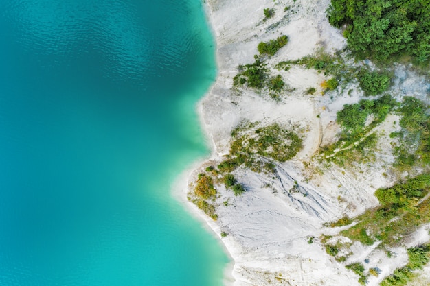 The shores of the mountain lake, the blue water in the lake. Aerial view, from top to bottom