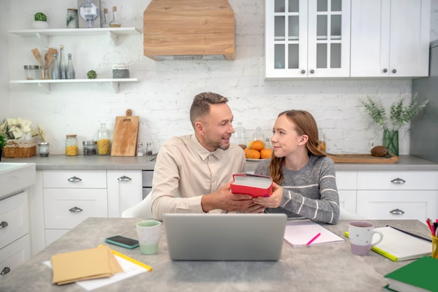 short-haired bearded teacher having a lesson with his student