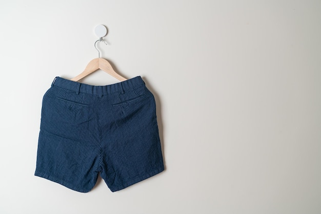 Short pants hanging on wall