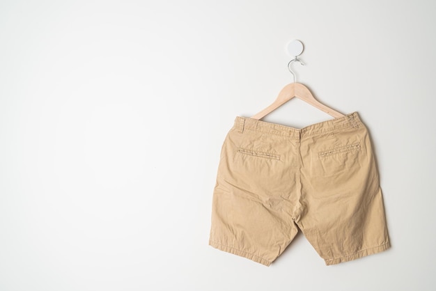 Short pants hanging on wall