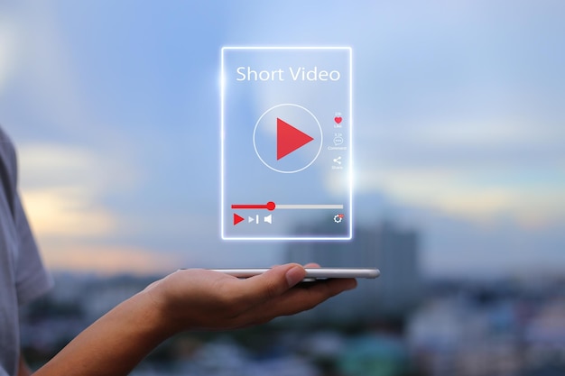 Photo short video marketing conceptman hands holding mobile phone showing virtual short video player with blurred city as background