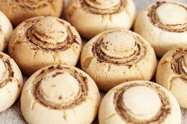 Shortbread cookies in form of champignons. Baked sweet biscuits. Tasty dessert.