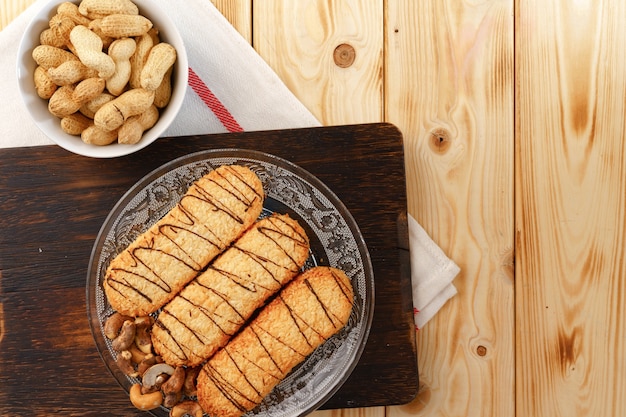 Shortbread cookies on wooden board close up photo