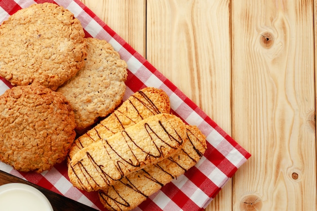 Shortbread cookies on wooden board close up photo