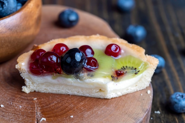 Shortbread fruit cake with cheese cream and berries delicious cake with different berries