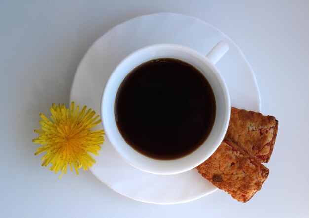 Shortbread rectangular biscuits with jam with dandelion tea