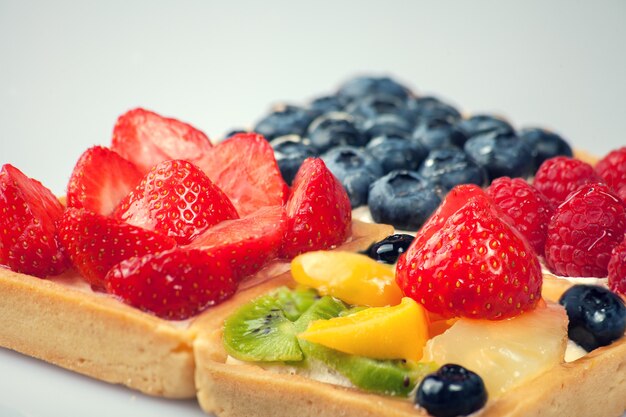 Shortcakes with berries on white background