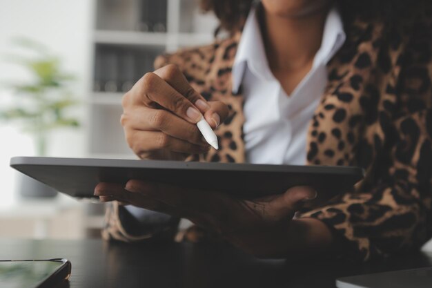 Photo shot of a asian young business female working on laptop in her workstation