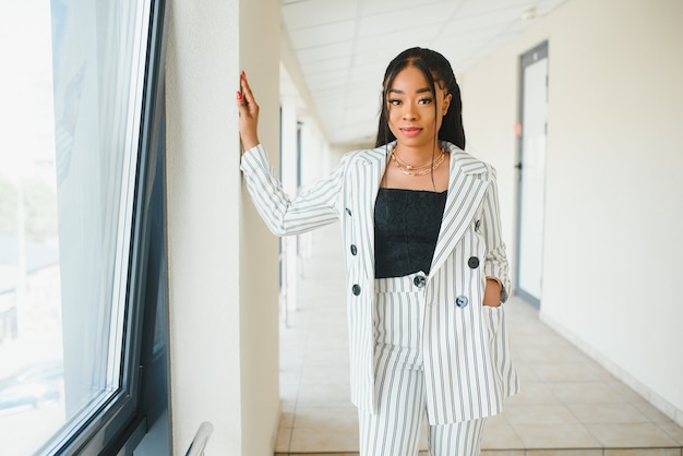 A shot of a beautiful black businesswoman outdoor