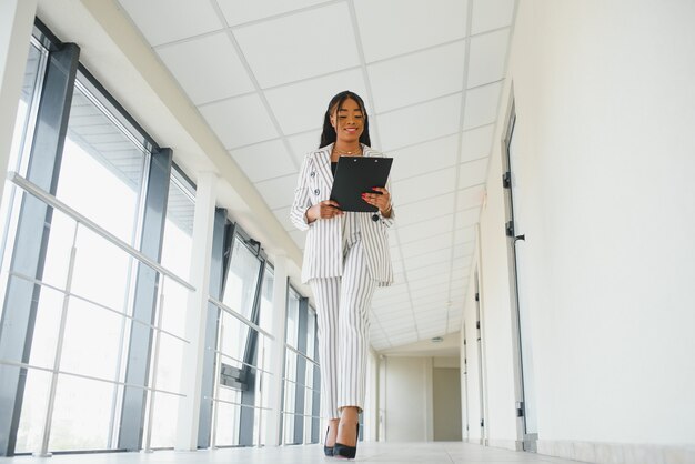 A shot of a beautiful black businesswoman outdoor