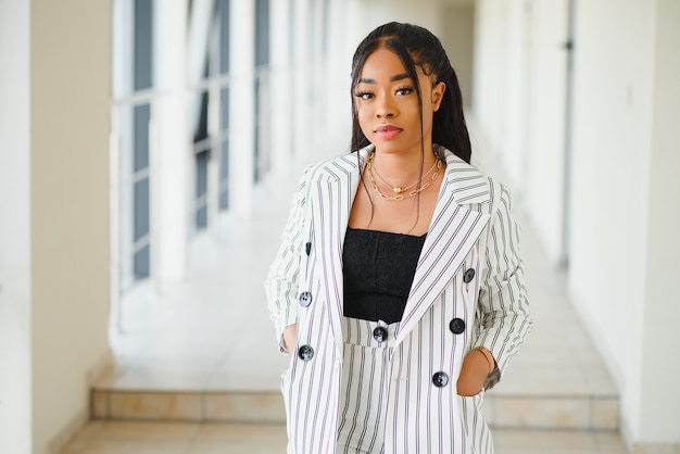 A shot of a beautiful black businesswoman outdoor