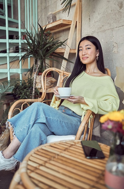 Shot of beautiful woman drinking coffee indoors