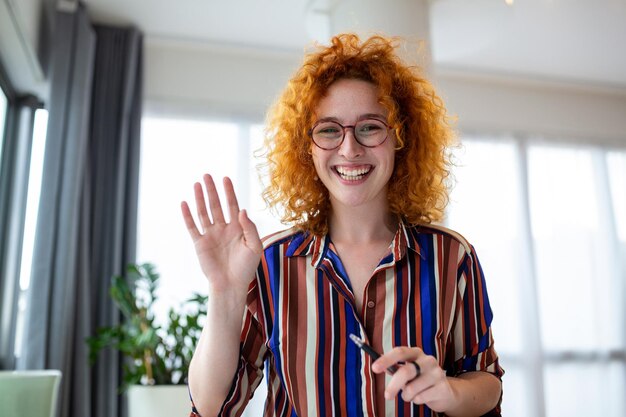 Shot of a businesswoman on a video call while sitting at her deskCropped shot of an attractive young woman using her laptop to make a video call at home