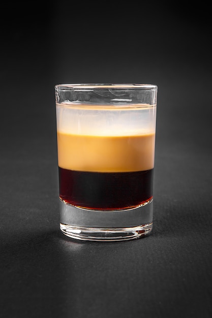 Shot of cocktail isolated black