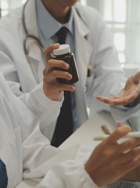 Photo shot of a female doctor working on medical expertise while sitting at desk in front of laptop