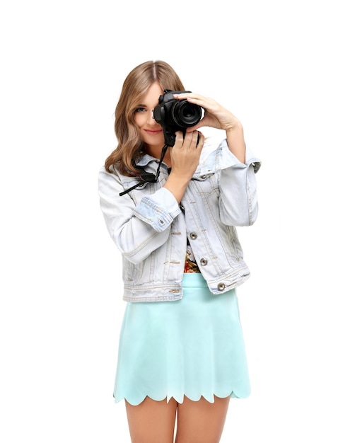 Shot of an funny young girl taking a photo with a camera