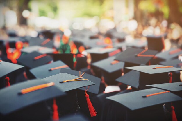 Photo shot of graduation hats during commencement success graduates of the university