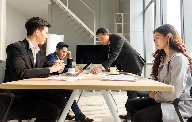 Shot of a group of businesspeople having a discussion in an office