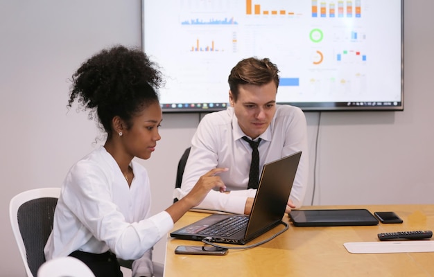 Photo shot of a group of businesspeople in a meeting at work