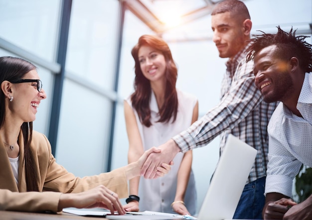 Shot of a group of businesspeople sitting together in a meeting