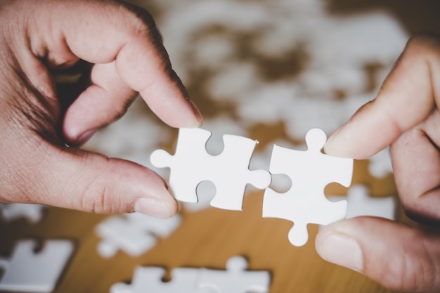 Shot of hand holding puzzle