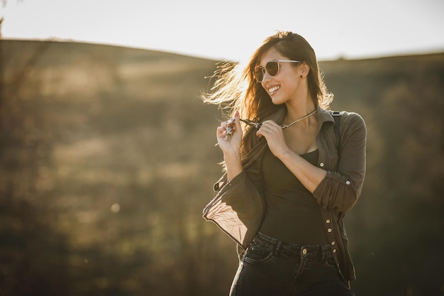 Shot of a happy young woman enjoying the outdoors.