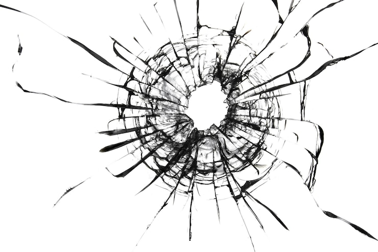 Photo shot hole texture of cracks on the glass broken windshield