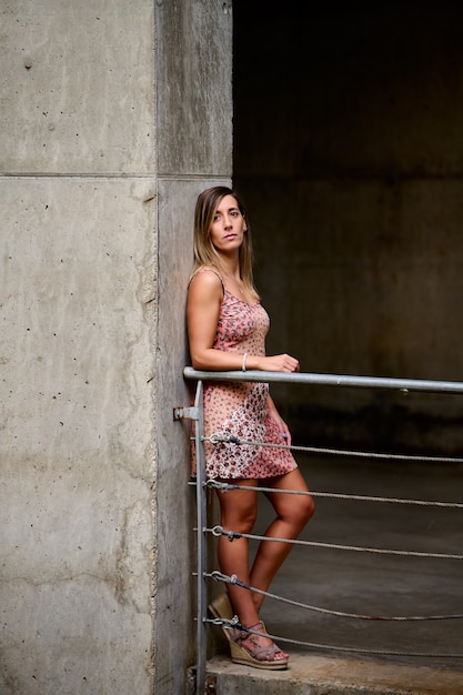 shot of a Spanish female in a red short flowery jumpsuit