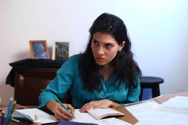 Photo shot of stressed business woman working from home on tired and overwhelmed