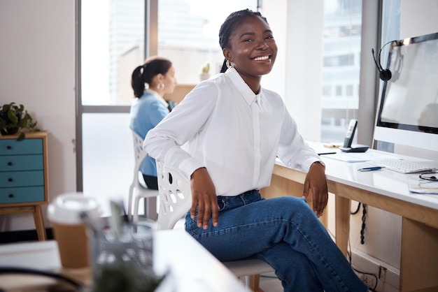 Shot of a young businesswoman using a computer at her desk in a modern office