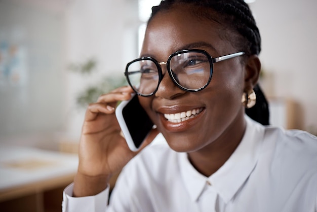 Shot of a young businesswoman using a smartphone in a modern office