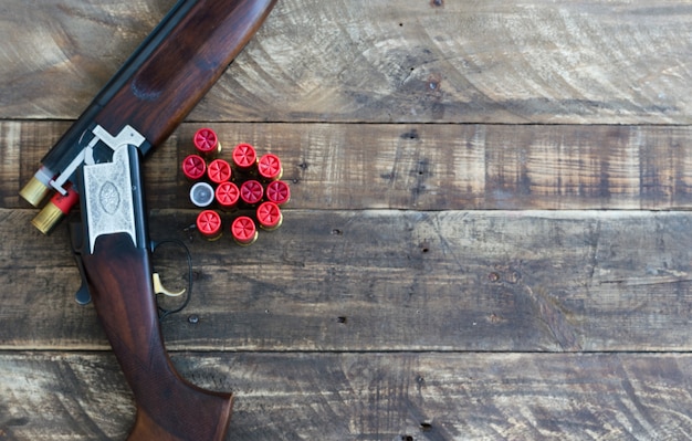 Shotgun with cannons superimposed with cartridges. Top view.