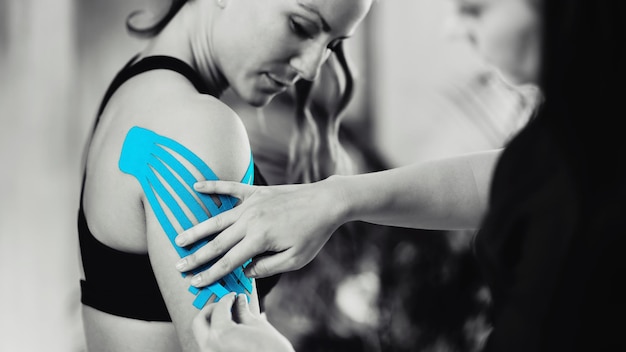 Shoulder Treatment With Blue Kinesiology Tape