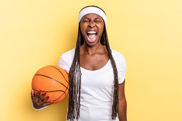 Shouting aggressively, looking very angry, frustrated, outraged or annoyed, screaming no. basket concept