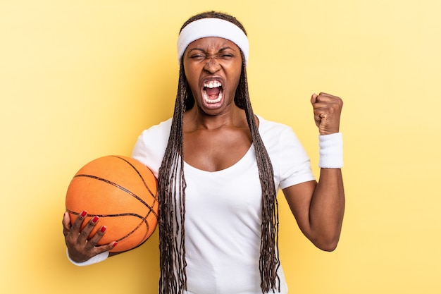 shouting aggressively with an angry expression or with fists clenched celebrating success. basket concept