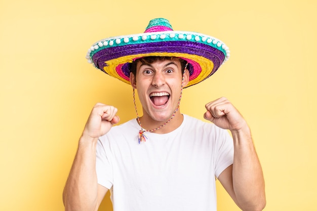 Shouting aggressively with an angry expression or with fists clenched celebrating success. mexican hat concept